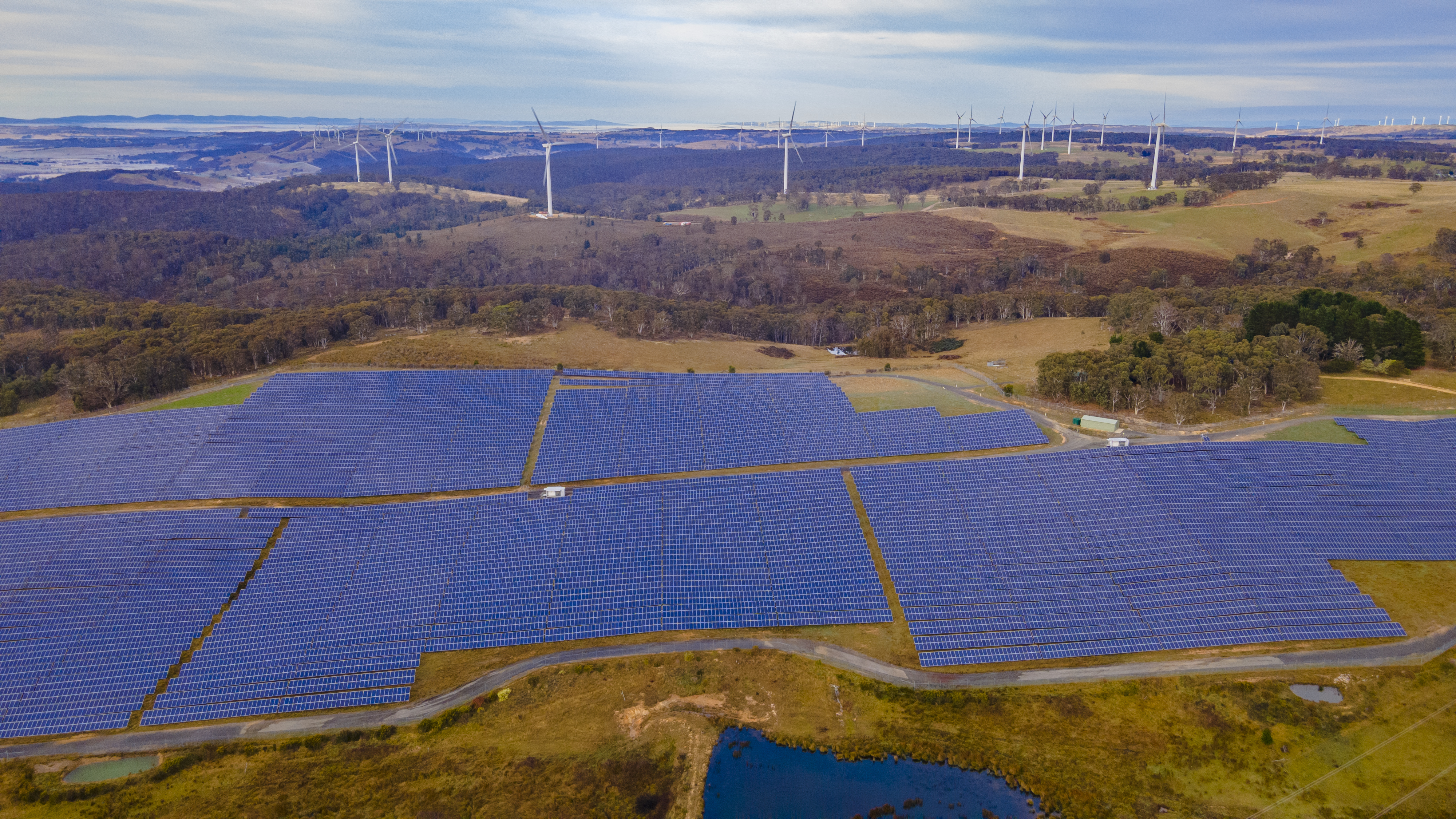 Aerial drone view of the hybrid Gullen Solar Farm and Gullen Range Wind Farm for renewable clean energy supply located at Bannister in NSW stock photo