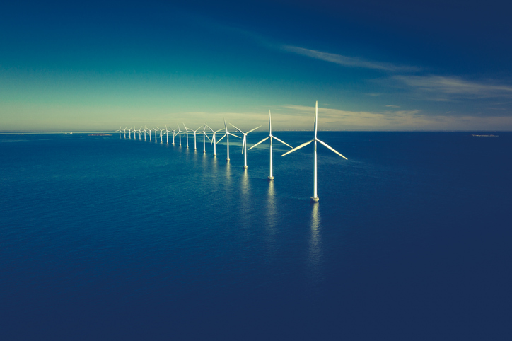 Offshore wind turbines in a deep blue ocean