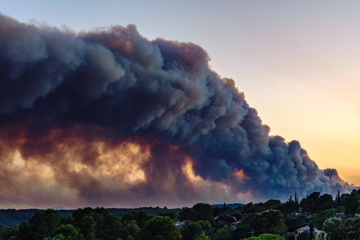 A view from the village of Flayosc (Var), France with forest fire smoke