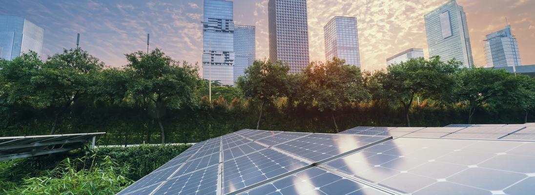 Solar panels with city backdrop