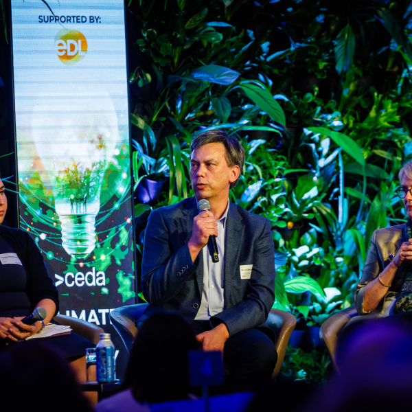 Brad Archer during panel discussion at CEDA 2024 Climate and Energy Forum with two other people.