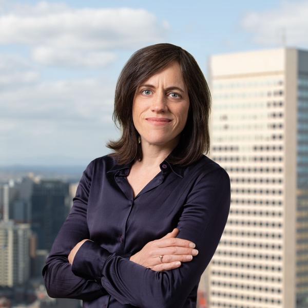 CEO Kath Rowley in front of a city skyline