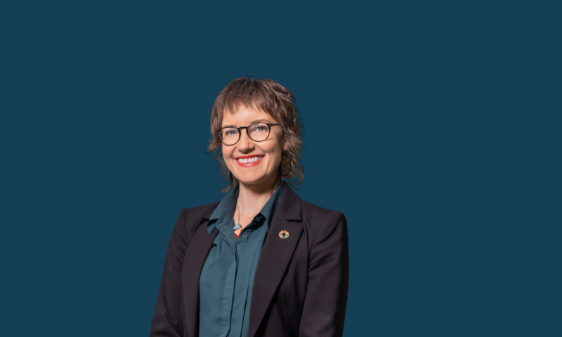 DCEO Eliza Murray on a dark blue background