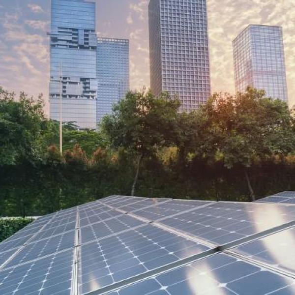 Solar panels with city backdrop
