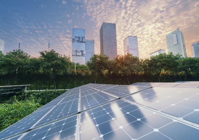 Solar panels with city backdrop